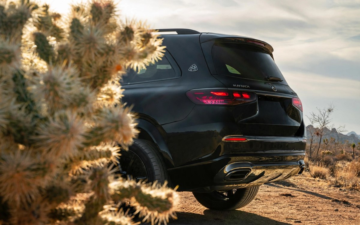 Black Maybach GLS, rear three-quarter view at sunset